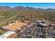 Expansive aerial view showcasing the outdoor mall and parking area with mountain views at 9270 E Thompson Peak Pkwy # 367, Scottsdale, AZ 85255