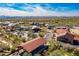 Aerial view of a commercial area with restaurants, shops, and mountain views in the background at 9270 E Thompson Peak Pkwy # 367, Scottsdale, AZ 85255