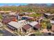 Overhead view of shopping area with multiple restaurants, parking, and mountain backdrop at 9270 E Thompson Peak Pkwy # 367, Scottsdale, AZ 85255
