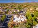 Scenic aerial view of desert homes nestled within a lush landscape and mountain backdrop at 9270 E Thompson Peak Pkwy # 367, Scottsdale, AZ 85255