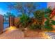 Private backyard patio features desert landscaping and a comfortable seating area, ideal for relaxation at 9270 E Thompson Peak Pkwy # 367, Scottsdale, AZ 85255