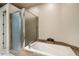 This bathroom boasts a soaking tub, granite countertops and a glass-enclosed shower at 9270 E Thompson Peak Pkwy # 367, Scottsdale, AZ 85255