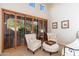 A sitting area in a spacious bedroom with shutters and natural light at 9270 E Thompson Peak Pkwy # 367, Scottsdale, AZ 85255
