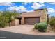 Exterior view of home showing the garage and well-maintained landscaping at 9270 E Thompson Peak Pkwy # 367, Scottsdale, AZ 85255