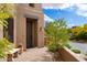 Exterior view of the front door and desert landscaping at 9270 E Thompson Peak Pkwy # 367, Scottsdale, AZ 85255