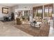 Open-concept living room showcases tile floors and elegant furniture at 9270 E Thompson Peak Pkwy # 367, Scottsdale, AZ 85255