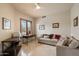 Relaxing living room with tile floors, comfortable seating, and a bright window for natural light at 9270 E Thompson Peak Pkwy # 367, Scottsdale, AZ 85255