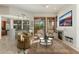 Beautiful living room with cozy fireplace, ceiling fan, and natural light at 9270 E Thompson Peak Pkwy # 367, Scottsdale, AZ 85255