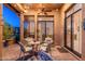 Charming covered patio with a ceiling fan and dining set, perfect for enjoying outdoor meals at 9270 E Thompson Peak Pkwy # 367, Scottsdale, AZ 85255