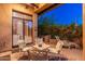 Cozy covered patio with outdoor kitchen, grill, and comfortable seating offers an ideal entertaining space at 9270 E Thompson Peak Pkwy # 367, Scottsdale, AZ 85255