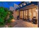 Stylish outdoor patio with desert landscaping and cozy seating enhances the home's curb appeal at 9270 E Thompson Peak Pkwy # 367, Scottsdale, AZ 85255
