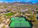 Aerial shot showcasing a pair of community tennis courts surrounded by desert foliage at 9270 E Thompson Peak Pkwy # 367, Scottsdale, AZ 85255