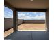 Unfinished backyard featuring a covered patio with views of the surrounding community at 9539 W Parkway Dr, Tolleson, AZ 85353