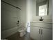 A view of a clean, well-lit bathroom featuring a tub and vanity at 9539 W Parkway Dr, Tolleson, AZ 85353