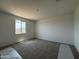 Bedroom with carpeted floors and a window view at 9539 W Parkway Dr, Tolleson, AZ 85353