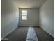 Bright bedroom featuring a window offering ample natural light at 9539 W Parkway Dr, Tolleson, AZ 85353