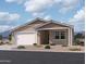Charming single-story home featuring a two-car garage and a welcoming covered entry at 9539 W Parkway Dr, Tolleson, AZ 85353