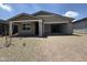 Beautiful single-story home featuring a spacious garage, brick-paved driveway, and well-maintained gravel yard at 9539 W Parkway Dr, Tolleson, AZ 85353