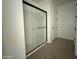 Walk-in shower featuring a glass enclosure, with tile floors and white walls at 9539 W Parkway Dr, Tolleson, AZ 85353