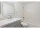 Clean bathroom featuring a vanity with a gray cabinet and a shower-tub combo at 9740 E Baltimore Cir, Mesa, AZ 85207