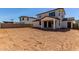 View of the home's backyard featuring a covered patio and block wall fence at 10229 N 49Th Dr, Glendale, AZ 85302