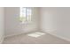 This bedroom features neutral walls, carpeted floors, and a large window at 10229 N 49Th Dr, Glendale, AZ 85302