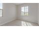 Bright and carpeted bedroom with a large window at 10229 N 49Th Dr, Glendale, AZ 85302