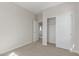 This bedroom features neutral walls, carpeted floors, and a closet with sliding doors at 10229 N 49Th Dr, Glendale, AZ 85302