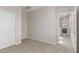 This bedroom features neutral walls, carpeted floors, and an open door at 10229 N 49Th Dr, Glendale, AZ 85302