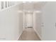 Bright entryway featuring wood-look tile flooring, white walls, and staircase access at 10229 N 49Th Dr, Glendale, AZ 85302