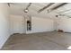 Spacious two car garage with ample storage and concrete flooring, and water heater at 10229 N 49Th Dr, Glendale, AZ 85302