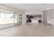 Open-concept living room with wood-look tile floors and seamless transition to the kitchen at 10229 N 49Th Dr, Glendale, AZ 85302