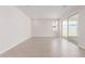 Open-concept living room with wood-look tile floors and natural lighting at 10229 N 49Th Dr, Glendale, AZ 85302