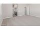 Spacious primary bedroom with neutral carpet, ensuite access, and walk-in closet at 10229 N 49Th Dr, Glendale, AZ 85302