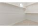 Spacious walk-in closet with built-in shelving and carpet at 10229 N 49Th Dr, Glendale, AZ 85302