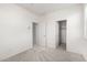 A bright bedroom with closet and adjacent door ready for personalization and comfortable living at 1176 N 169Th Ave, Goodyear, AZ 85338