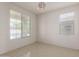 Bright, spacious bedroom with tile floors, a contemporary light fixture, and plenty of natural light at 1176 N 169Th Ave, Goodyear, AZ 85338