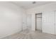 A bright bedroom with closet and adjacent door ready for personalization and comfortable living at 1176 N 169Th Ave, Goodyear, AZ 85338