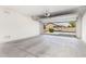 Spacious two-car garage with an open door offering a glimpse of the home's curb appeal at 1176 N 169Th Ave, Goodyear, AZ 85338