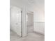 Upstairs hallway featuring neutral carpeting, leading to bedrooms and offering an open, airy feel at 1176 N 169Th Ave, Goodyear, AZ 85338
