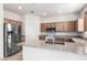 Modern kitchen with granite countertops, stainless steel appliances, and ample cabinet space at 1176 N 169Th Ave, Goodyear, AZ 85338