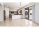 Contemporary kitchen featuring stainless steel appliances, granite countertops, and a sliding door at 1176 N 169Th Ave, Goodyear, AZ 85338