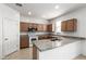 Modern kitchen featuring granite countertops, stainless steel appliances, and a breakfast bar at 1176 N 169Th Ave, Goodyear, AZ 85338