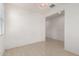 Empty living room with tile flooring and neutral walls, ready for personalization and decor at 1176 N 169Th Ave, Goodyear, AZ 85338