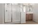 Contemporary glass-enclosed shower with modern fixtures and bright natural light at 1176 N 169Th Ave, Goodyear, AZ 85338