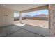Covered patio overlooking the backyard with block wall perimeter at 12327 W Luxton Ln, Avondale, AZ 85323