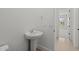 This bathroom features a vessel sink and an open doorway to another room at 12327 W Luxton Ln, Avondale, AZ 85323