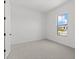 The bedroom features neutral carpet, white walls, and a bright window at 12327 W Luxton Ln, Avondale, AZ 85323