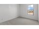 This bedroom has gray carpet and a window that provides natural light at 12327 W Luxton Ln, Avondale, AZ 85323