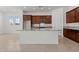 Modern kitchen featuring a large island with granite countertops and stainless steel appliances at 12327 W Luxton Ln, Avondale, AZ 85323